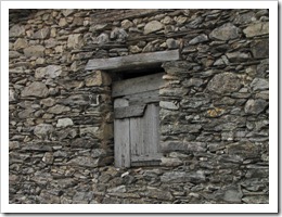 An old window in a stone wall